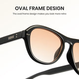 Black oval frame sunglasses with rose gold lenses on a white background