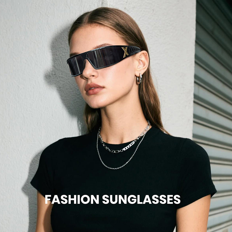 Woman wearing black sunglasses with a plain background