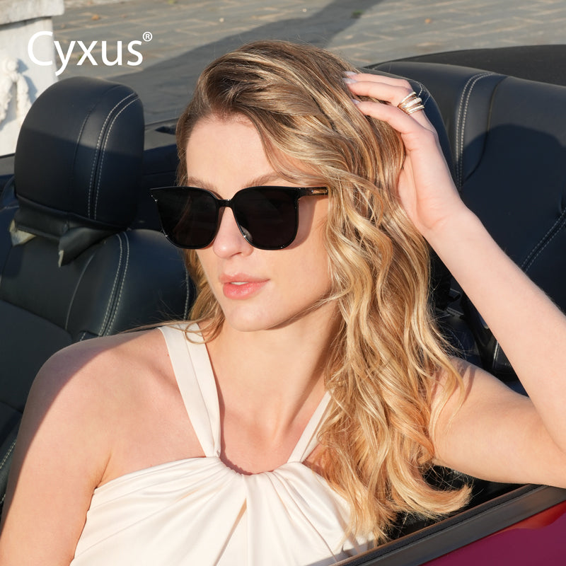 Woman wearing Cyxus polarized sunglasses 1711 sitting in a convertible car with 'Cyxus' branding.