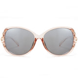 The lenses are polarized, enhancing visual clarity and reducing glare, making them both stylish and functional.