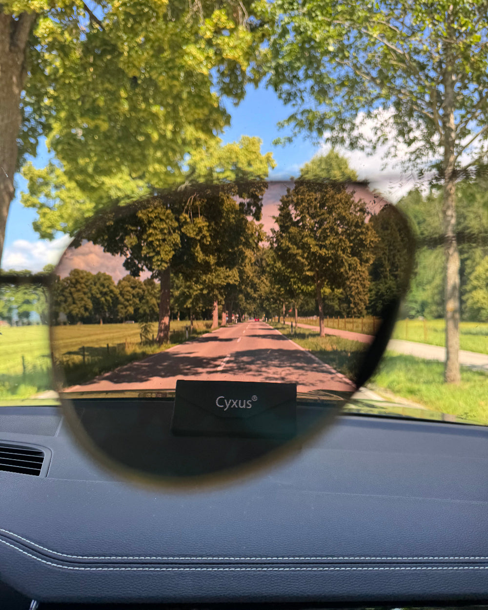 Cyrax rearview mirror with a scenic road view