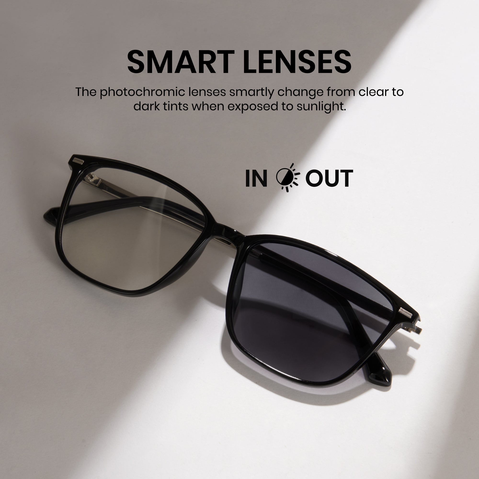 Black sunglasses with smart lenses on a light gray background