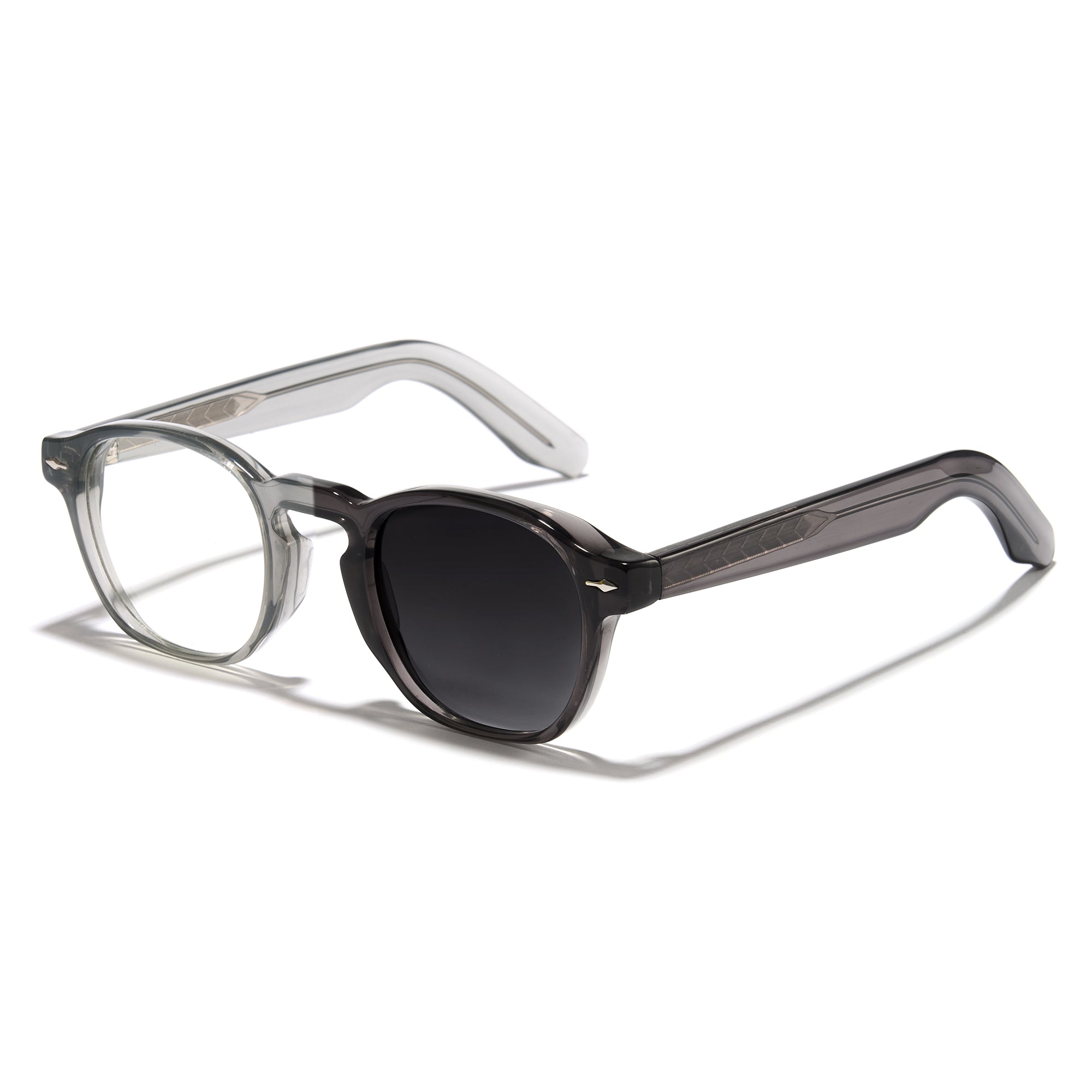 Photochromic glasses with a clear frame and black lenses on a white background