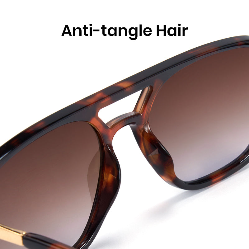 Sunglasses with tortoiseshell frame and brown lenses on a white background