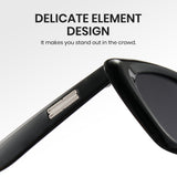 Black sunglasses with a close-up of the frame on a white background, featuring text about delicate element design.