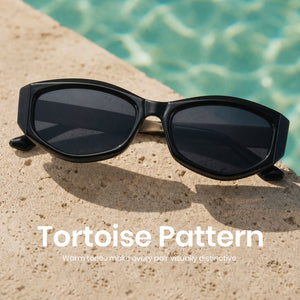 Black oval PC frame sunglasses with matty gold metal temples, non-polarized grey AC lens