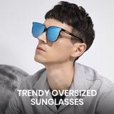 Person wearing trendy oversized sunglasses with a plain background