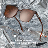 Brown sunglasses on crumpled silver foil with text 'Fashion Trend Simple & Comfortable'.