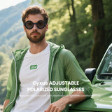 Man wearing Cyxus adjustable polarized sunglasses with a green jacket and white shirt in a forest setting.