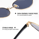 Sunglasses with gold frame and black arm, featuring skin-friendly nose pads and stable hinge on a white background.