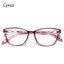 Pink cat-eye glasses with gold accents on a white background, branded 'Cyxus'.