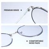 Close-up of eyeglasses with highlighted premium hinge and comfortable nose pads on a light blue background.