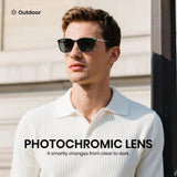 Man wearing sunglasses with photochromic lenses in an outdoor setting