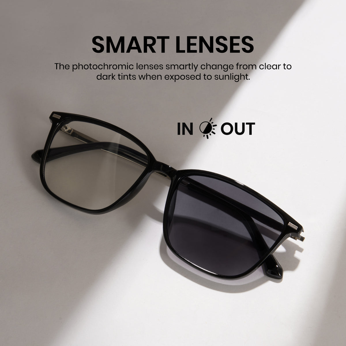 Black sunglasses with smart lenses on a light gray background