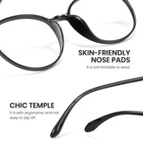 Black eyeglasses with text highlighting skin-friendly nose pads and chic temple design on a white background.
