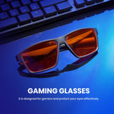 Gaming glasses 8303 with orange lenses on a blue surface, keyboard in the background