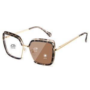 Tortoise oversized photochromic eyewear, gold metal arms, blue light blocking square frame