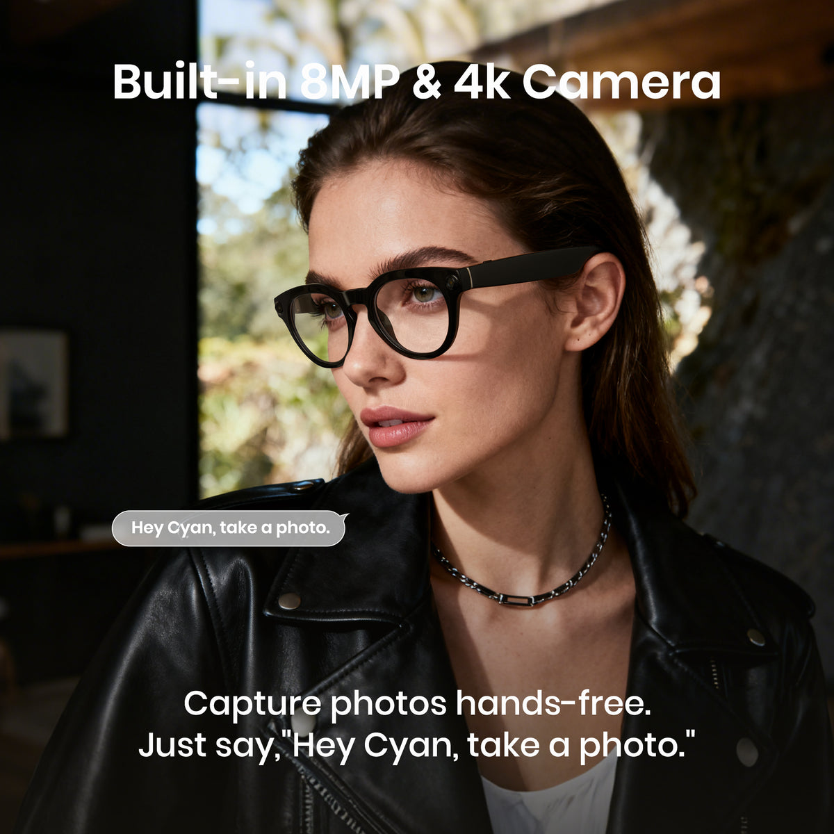 Woman wearing glasses with a text overlay about a built-in camera and hands-free photo capture feature.