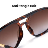 Sunglasses with tortoiseshell frame and brown lenses on a white background